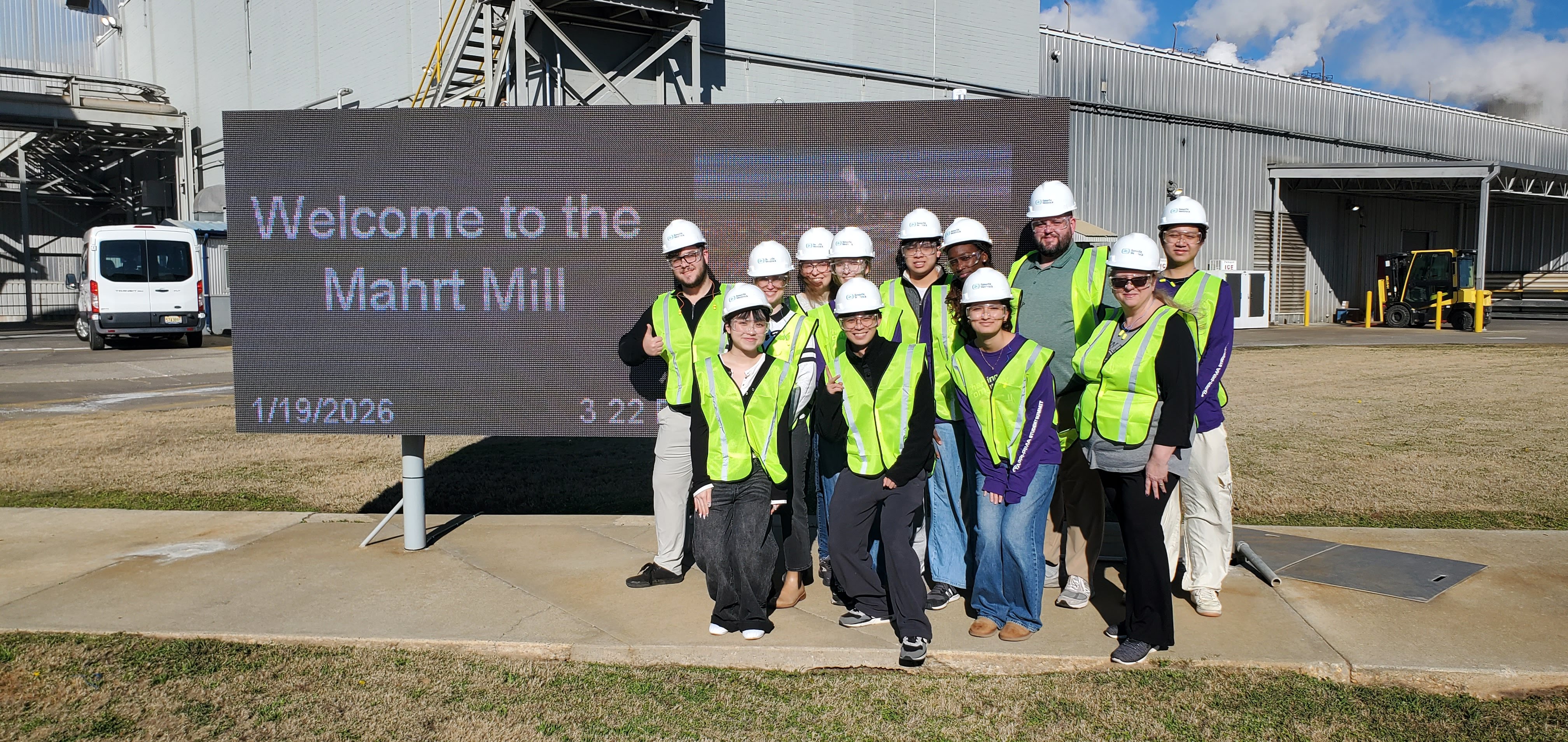 Students of Tappi posing beside Mahrt Mill Sign